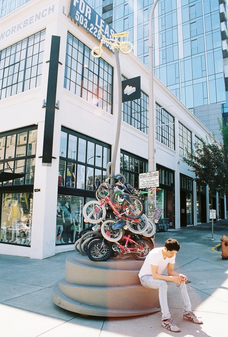 Paul sitting at this new monument - the bikes (which I believe belong to the zoobombers) used to just be locked up in a big pile down this street.